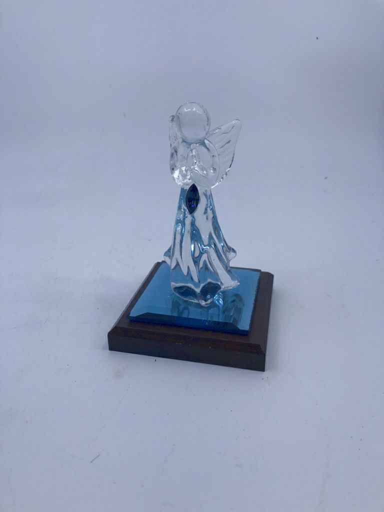 GLASS ANGEL ON WOOD BLOCK.