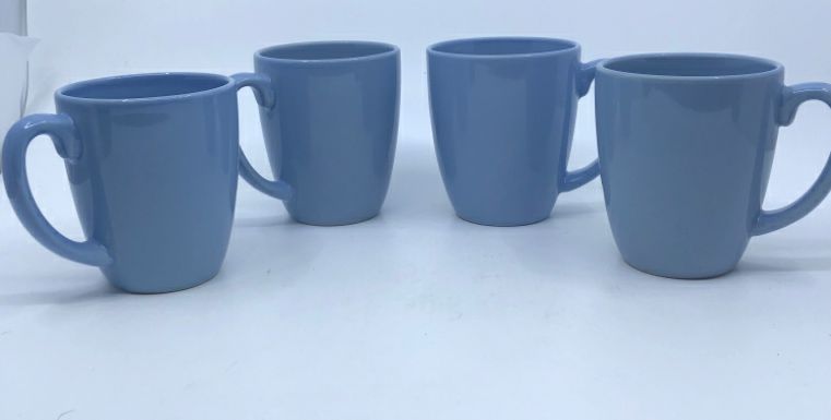 4 LIGHT BLUE CORELLE MUGS.