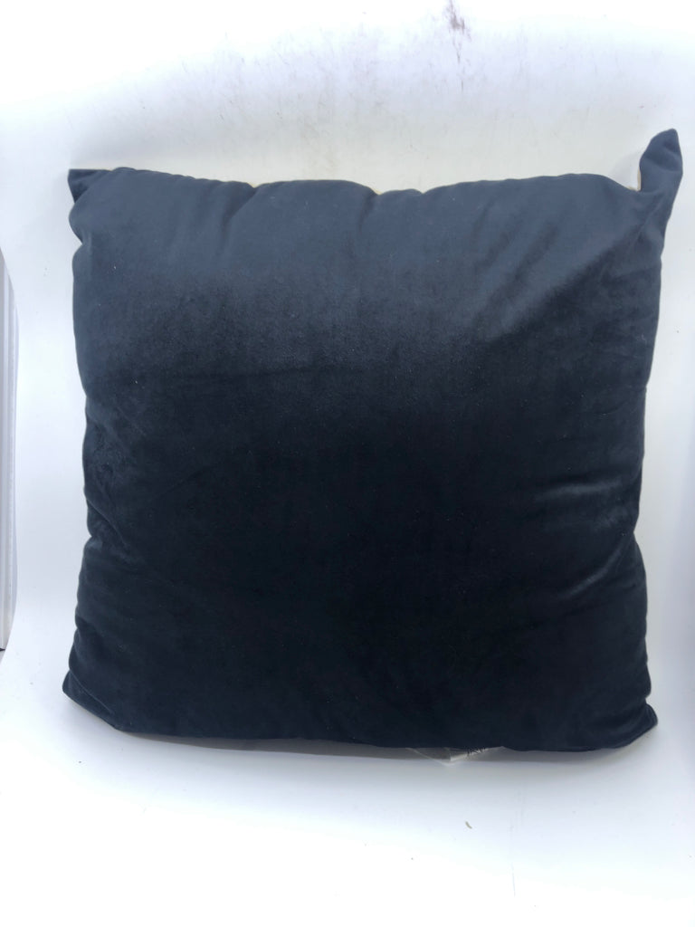 BLACK AND TAN PILLOW.