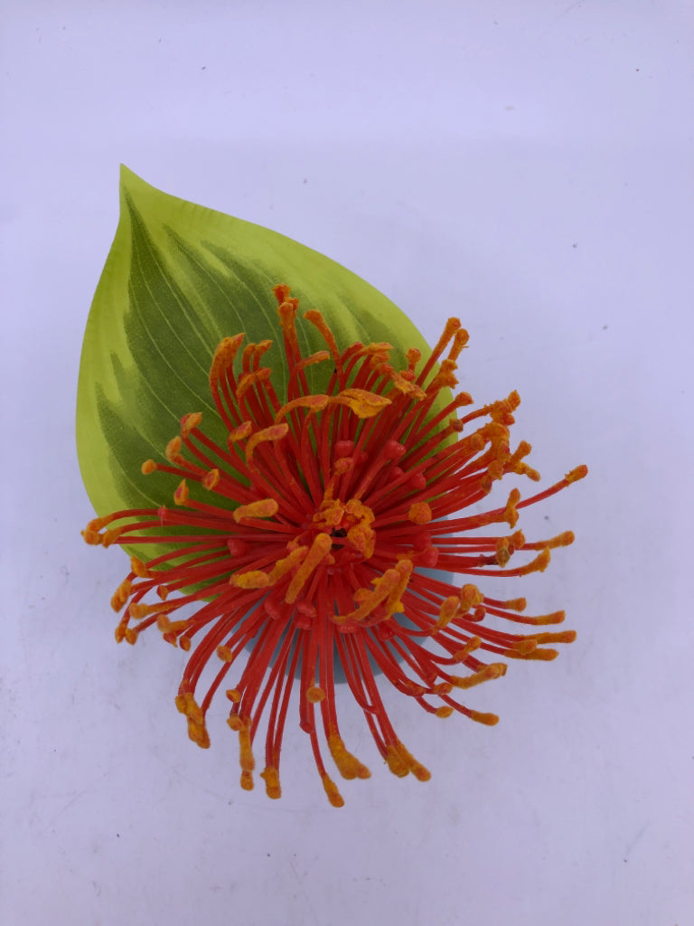 SMALL TEAL VASE W/ FAUX LEAVE ORANGE FLOWER.
