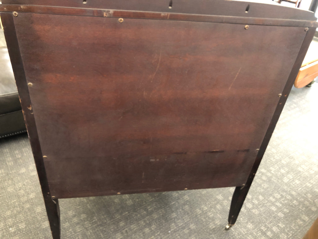 VTG DARK WOOD DRESSER W/5 DRAWERS & ORNATE METAL PULLS ON WHEELS.