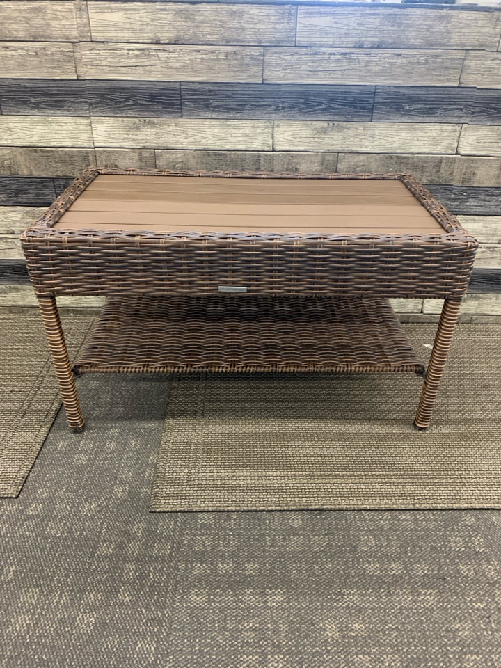 DARK WICKER W FAUX WOOD TOP COFFEE TABLE.