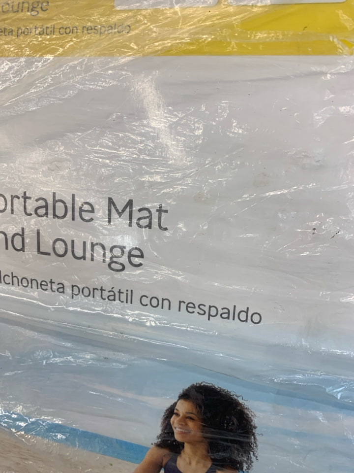 NIP PORTABLE BEACH MAT AND LOUNGE.