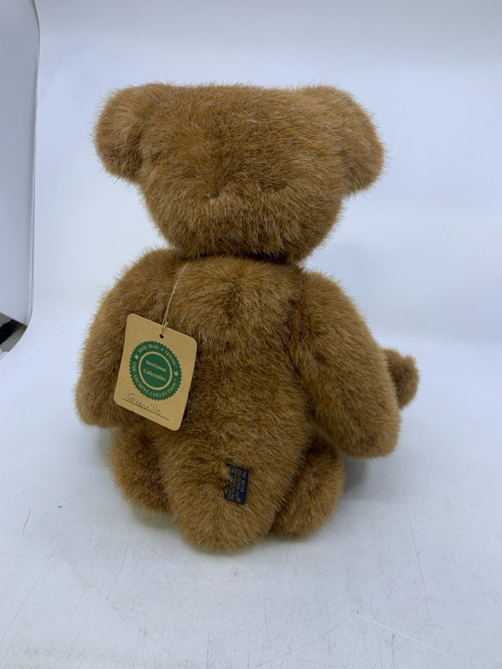 CARMEL COLORED BEAR W/ RED RIBBON.