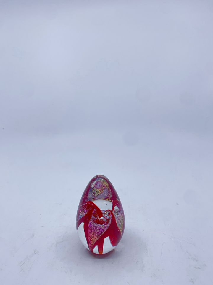 RED GLITTER PAPER WEIGHT.