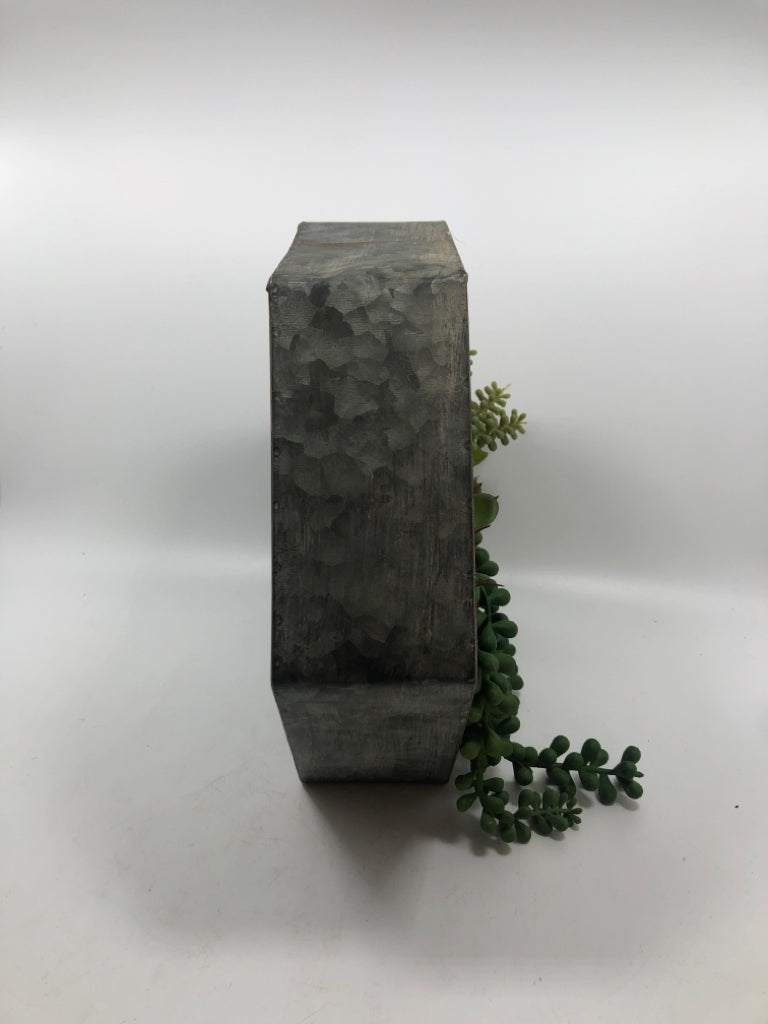 FAUX SUCCULENTS IN STANDING GALVANIZED PLANTER.