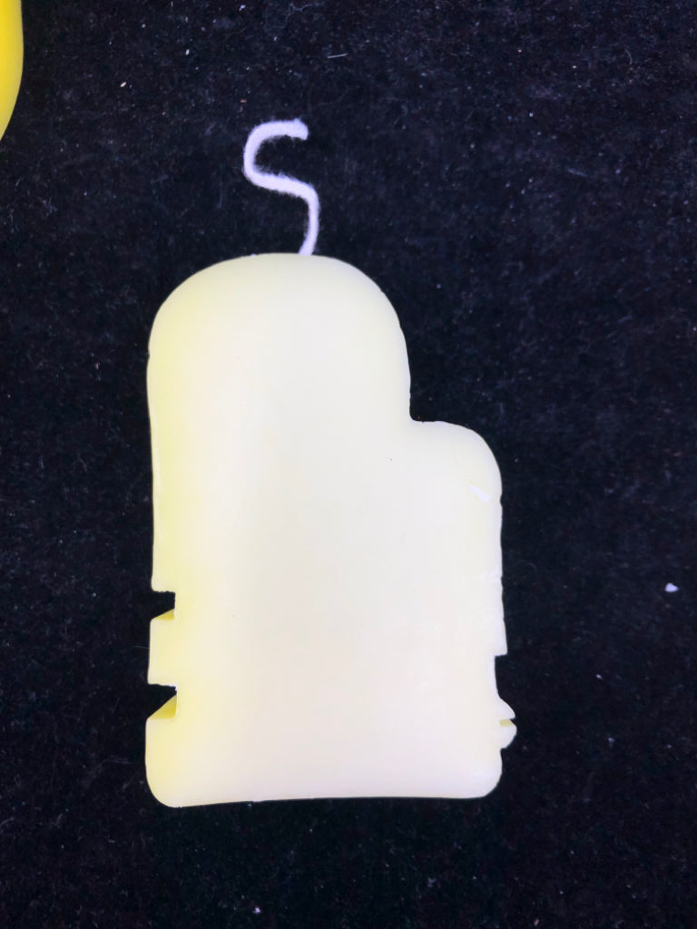 3 ABSTRACT FACE SHAPED CANDLES.