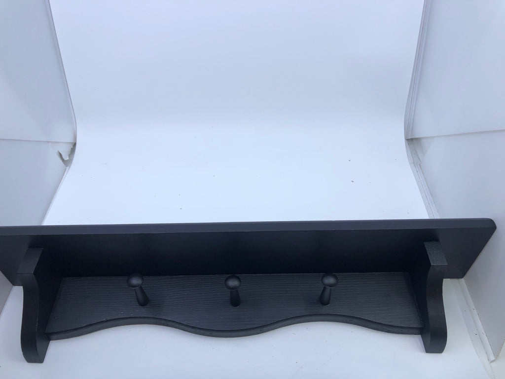 BLACK WOOD WALL SHELF W/COAT HOOKS.