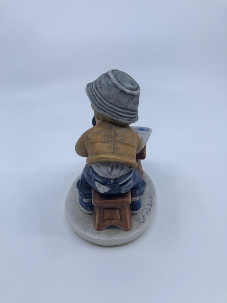 GOEBEL SITTING BOY W/MAGNIFY GLASS- STAMP COLLECTOR.