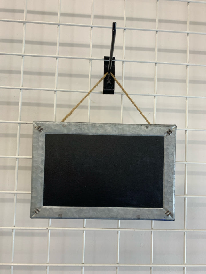 CHALKBOARD AND METAL FRAMED WALL HANGING.
