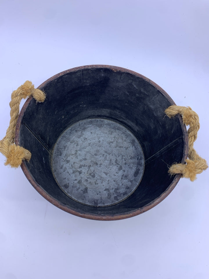 METAL BUCKET W ROPE HANDLES.