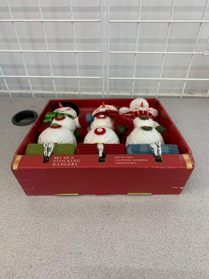 NIP 3 PC SNOWMAN STOCKING HANGERS.