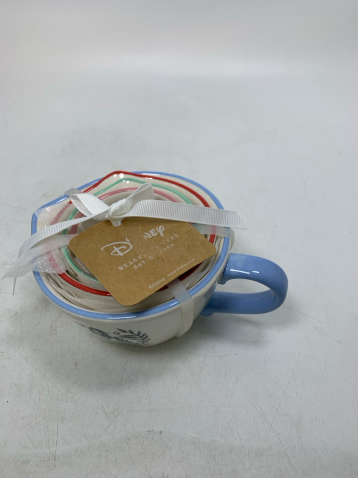 NIP 4 ALICE IN WONDERLAND MEASURING CUPS NESTING.