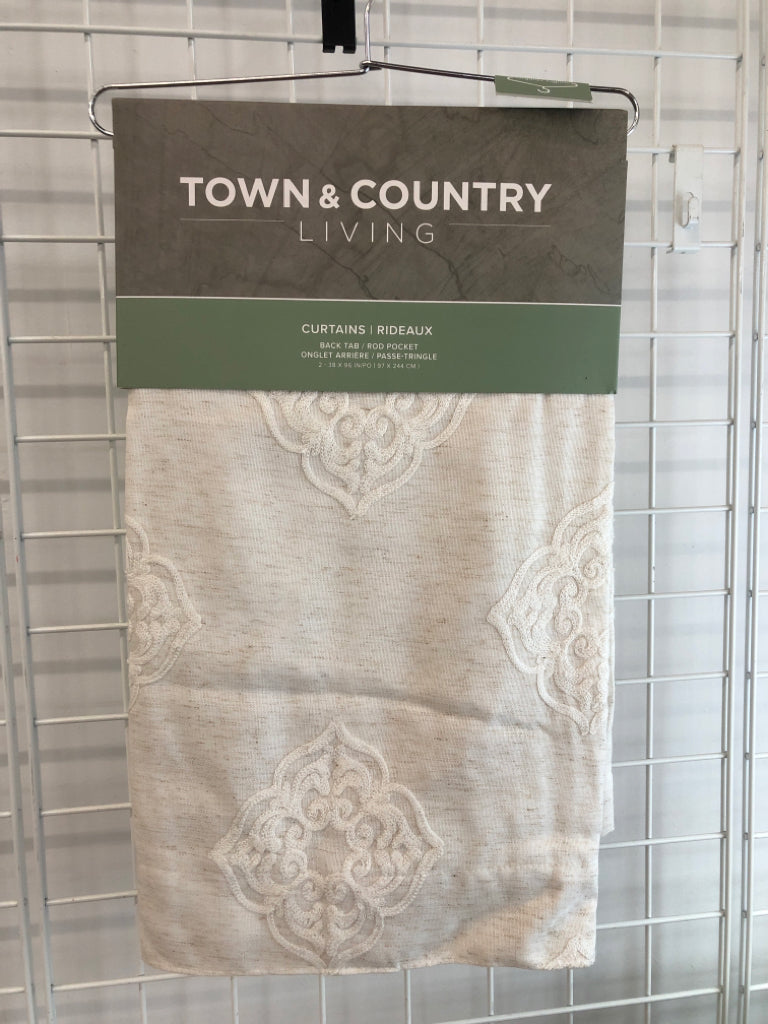 NIP 2PK CREAM BACK TAB CURTAINS.
