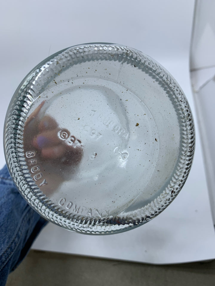 LARGE GLASS VASE WITH BLACK PIERCED LID.