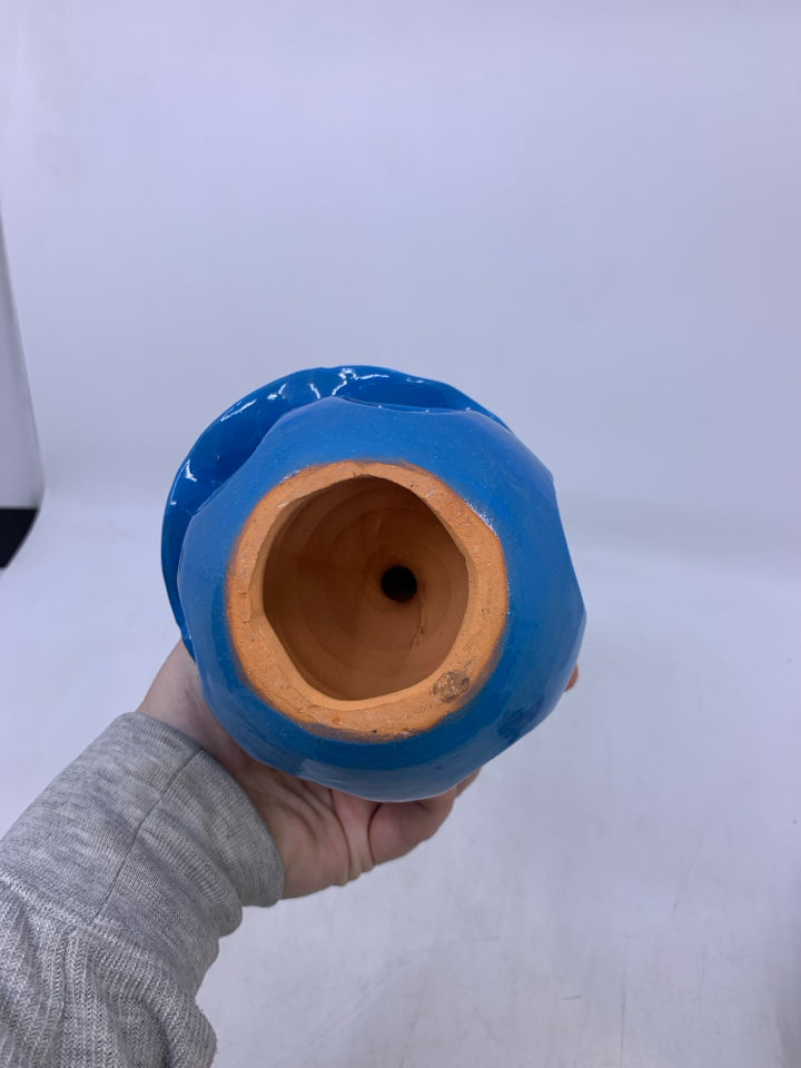 CLAY FACELESS WOMAN W/ BLUE DRESS W/ HOLES + WHITE HAT.