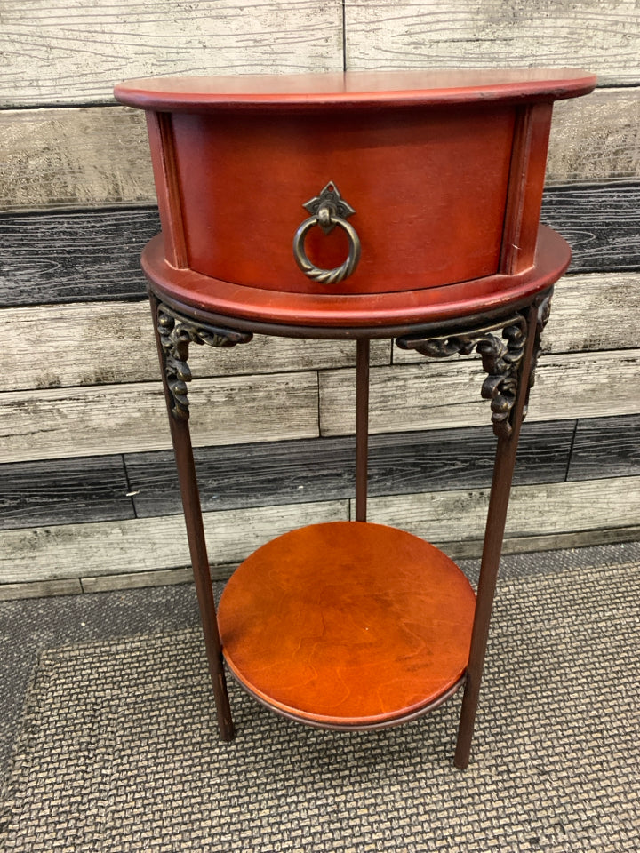 VTG ROUND RED WOOD END TABLE W/ DRAWER.