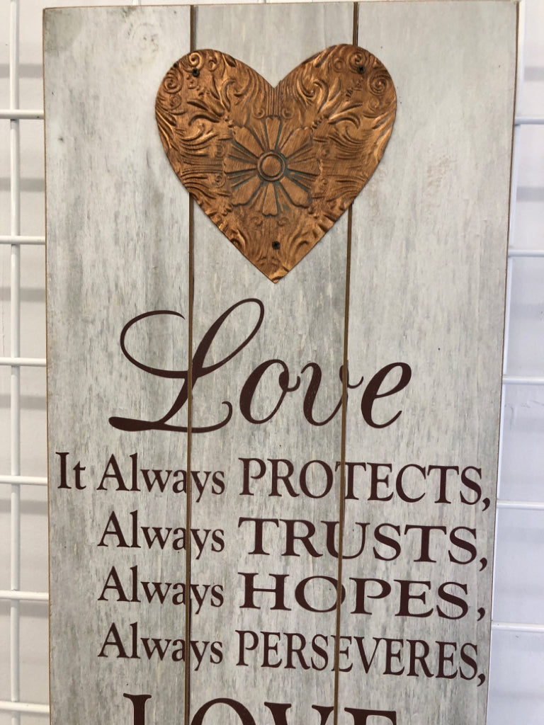 LOVE NEVER FAILS WOOD WALL ART.