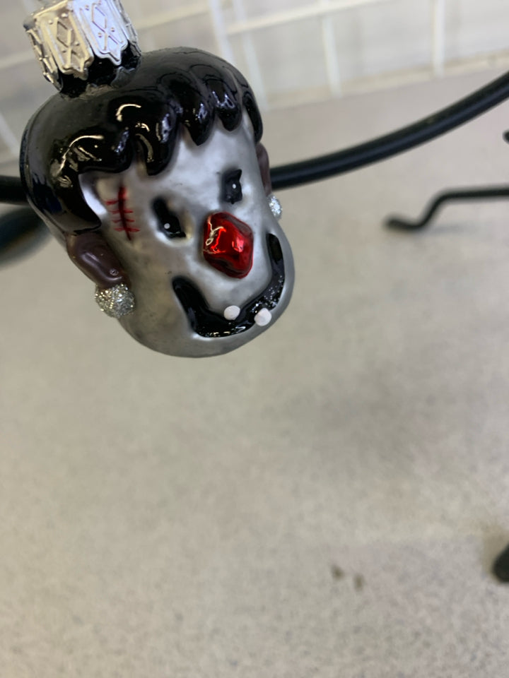 BLACK METAL MINI ORNAMENT TREE W CHRISTMAS AND HALLOWEEN ORNAMENTS.