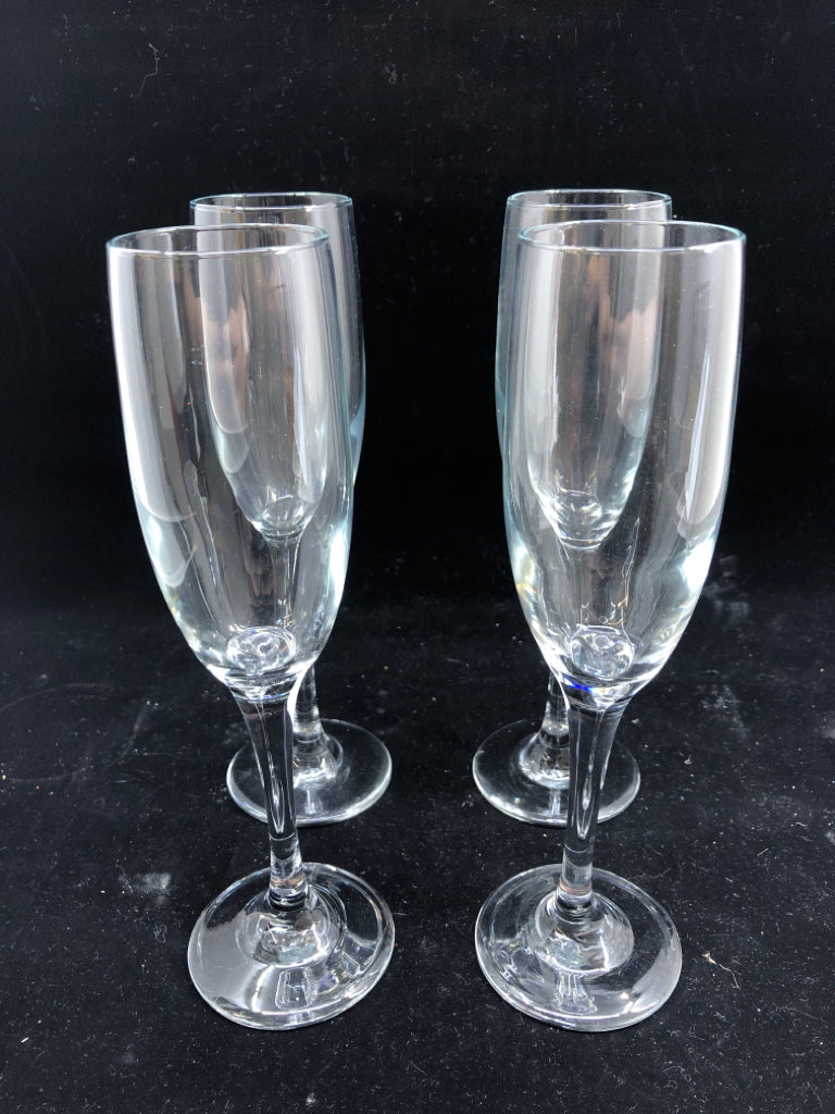4 CLEAR CHAMPAGNE GLASSES.
