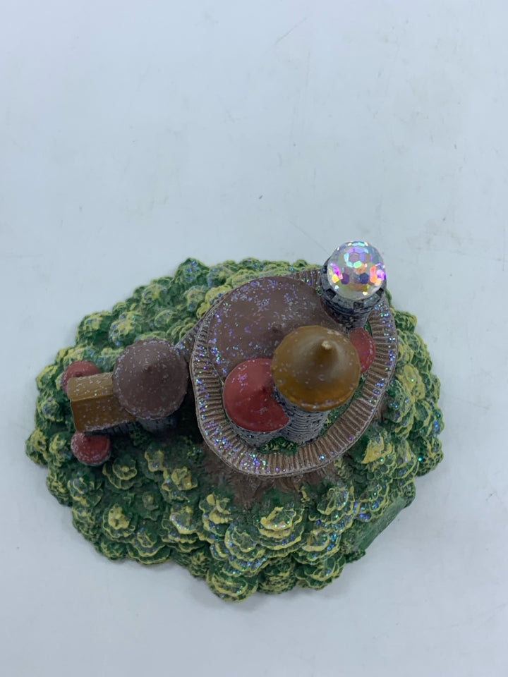 CASTLE WITH CRYSTAL BALL FIGURINE.