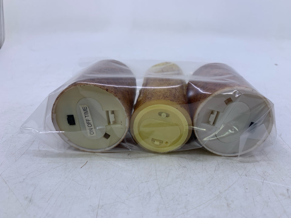 3 BATTERY POWERED FAUX CANDLES IN BAG.