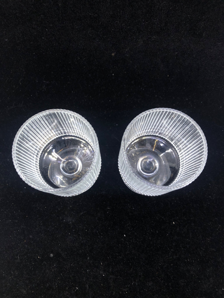 2 RIBBED GLASS FOOTED GLASSES.
