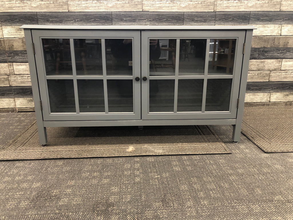 GREY ENTERTAINMENT CABINET W/1 SHELF AND GLASS DOORS.