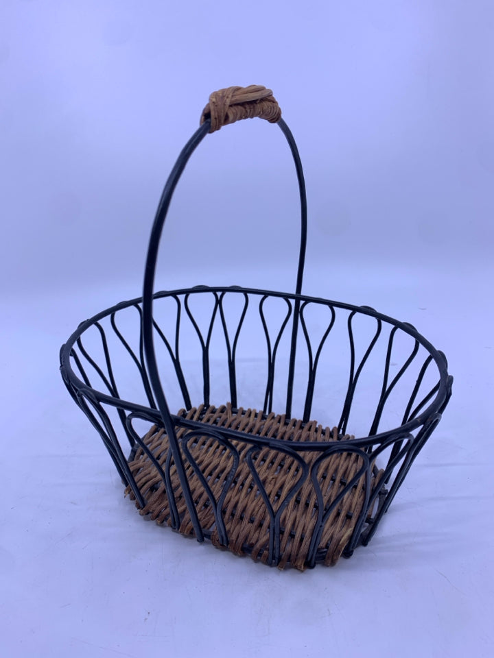 BLACK METAL BASKET W WOVEN BOTTOM AND HANDLE.