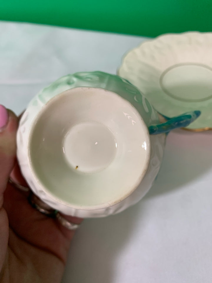 VTG CREAM AND GOLD ACCENT TEACUP AND SAUCER.