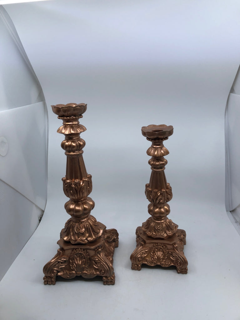 2 ROSE COLORED TAPER CANDLE HOLDERS.