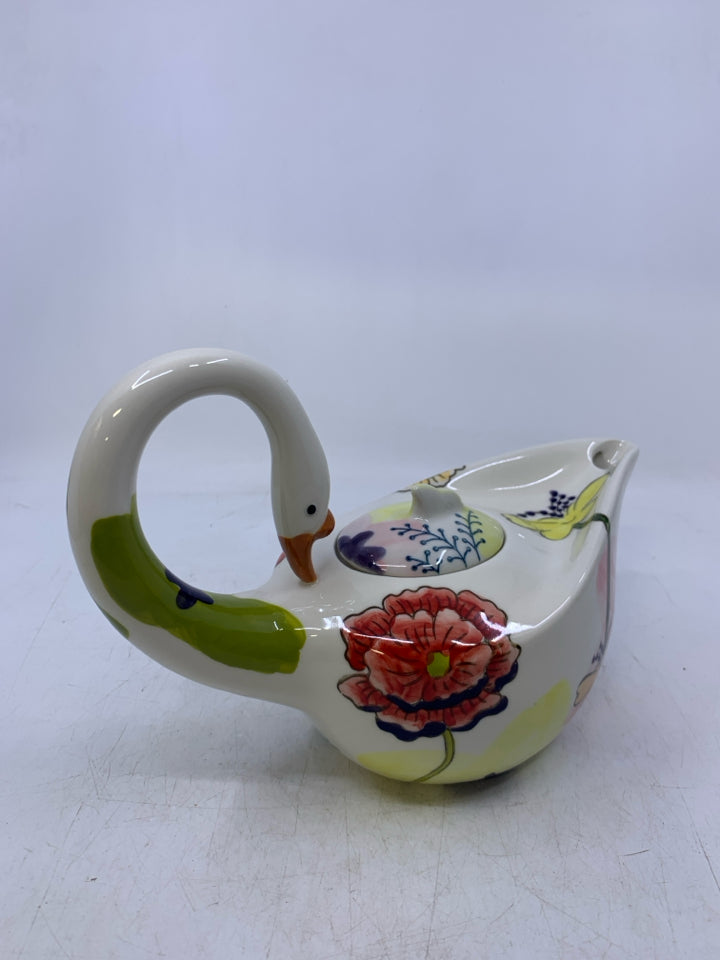 SWAN SHAPED W/ COLORFUL FLOWERS.