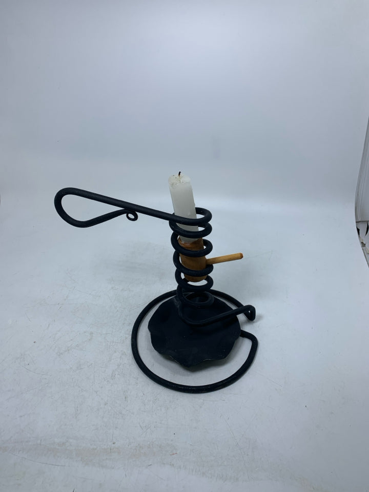 BLACK METAL COIL PRIMITIVE STYLE TAPERED CANDLE HOLDER.