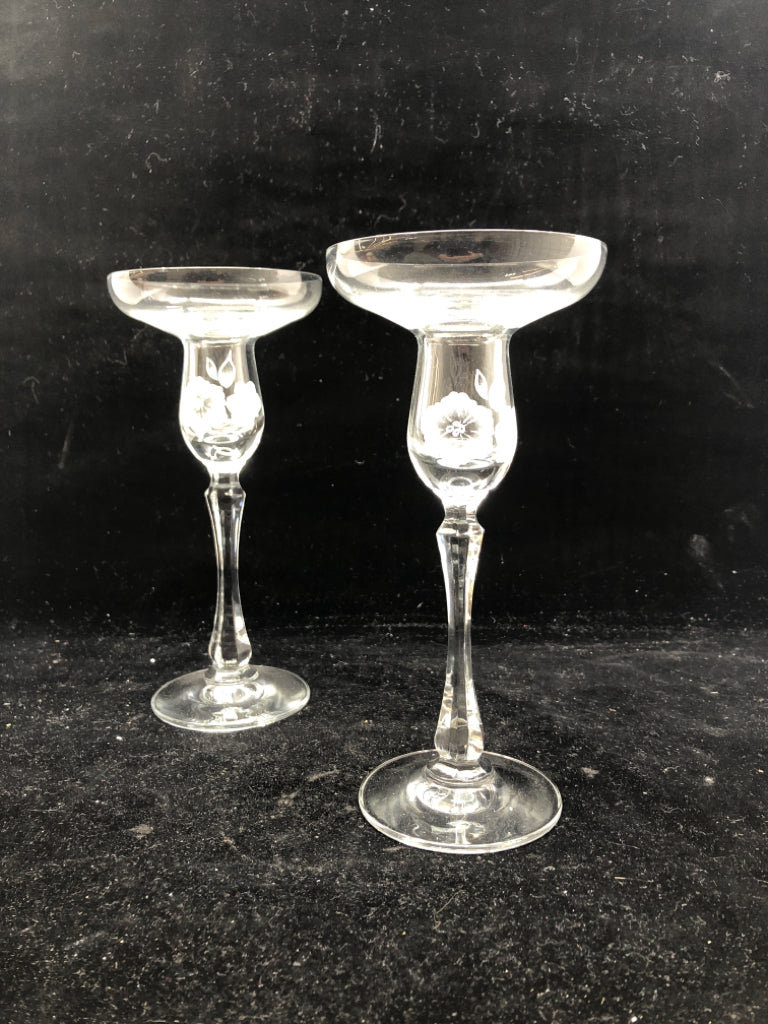 2 FOOTED GLASS FLORAL ETCHED TAPER CANDLE HOLDERS.