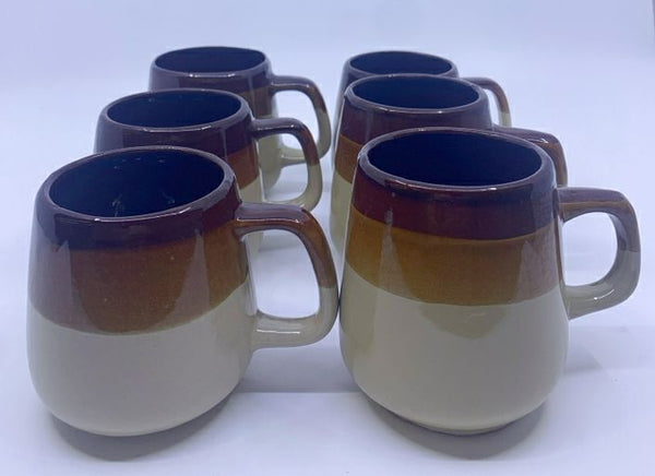 6 TWO TONED BROWN MUGS.