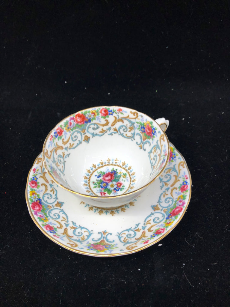 VTG BLUE AND PINK FLORAL TEACUP AND SAUCER.