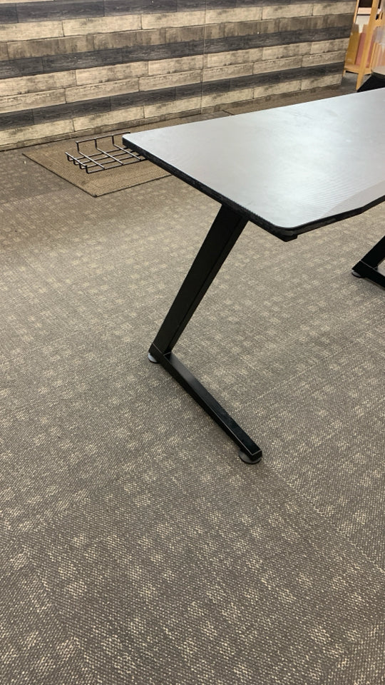 BLACK PLASTIC GAMING DESK W/ANGLED METAL LEGS.