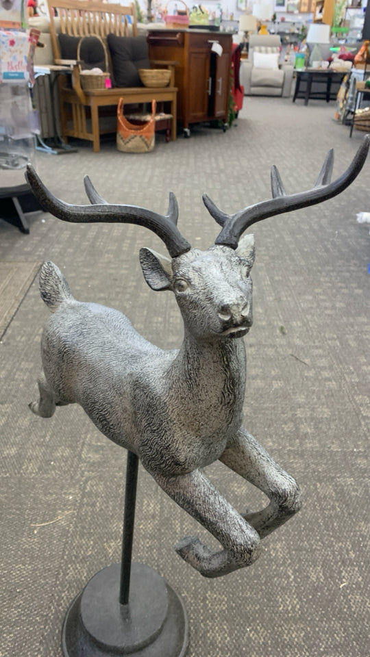 METAL REINDEER SCULPTURE ON HEAVY BASE.