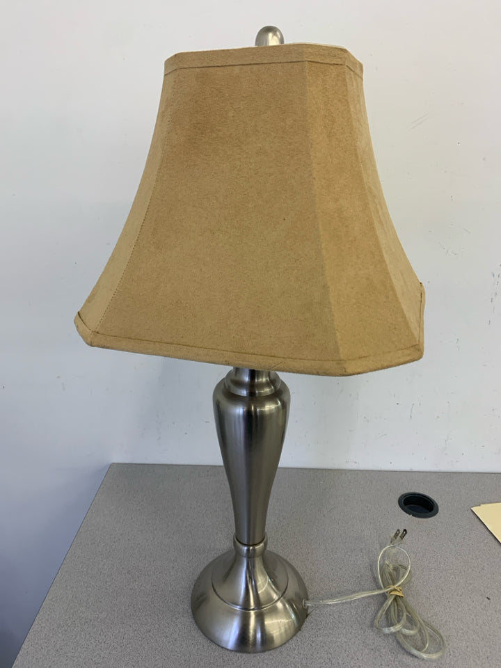 SILVER BASE LAMP W TAN SHADE.