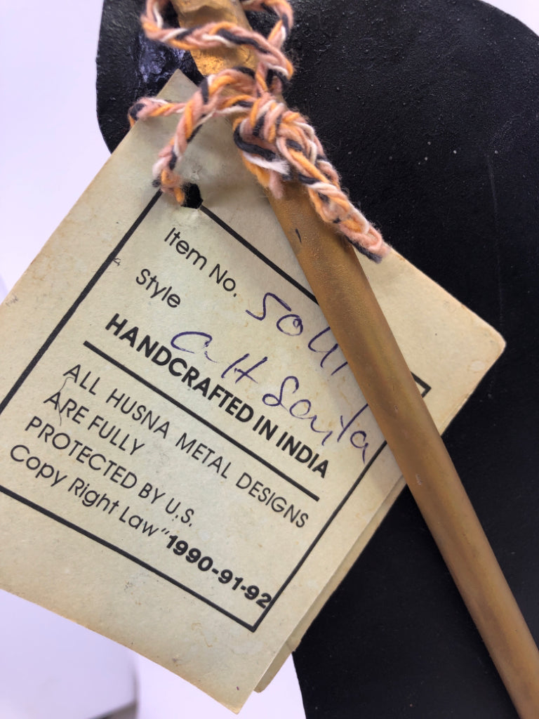 METAL SANTA TAPER CANDLE STICK.