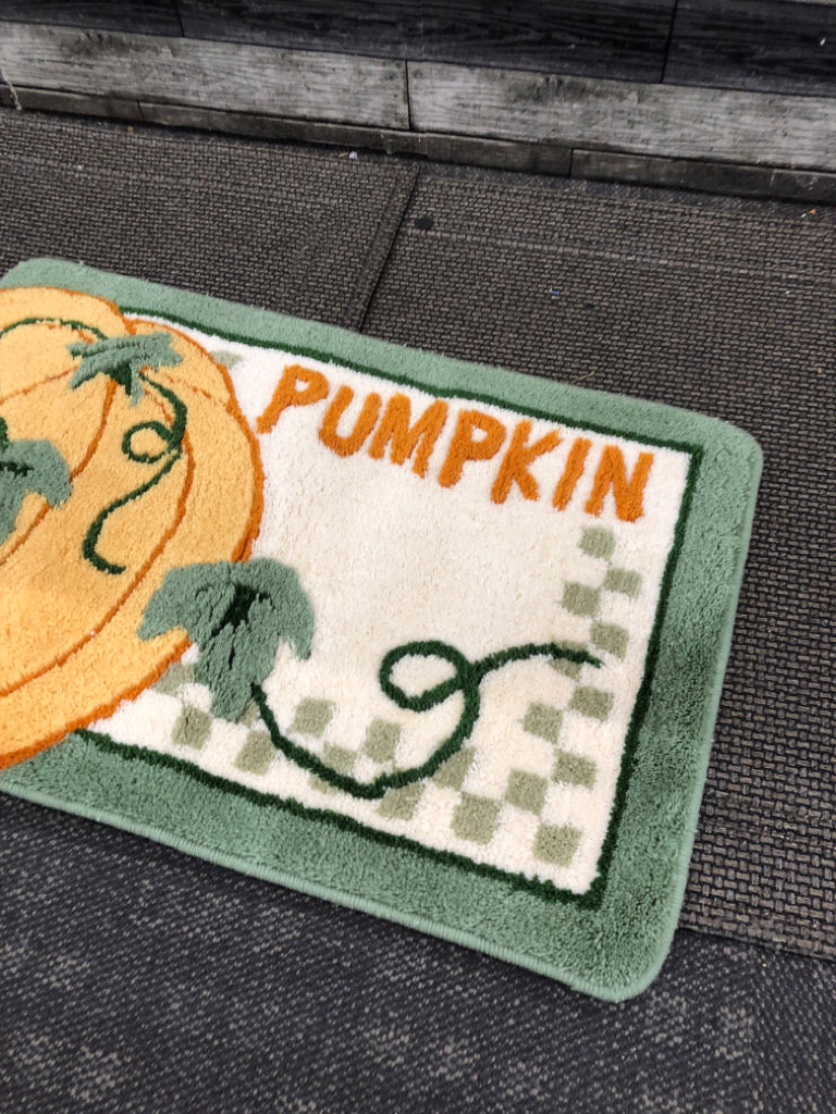 PUMPKIN AND GREEN BORDER RUG.