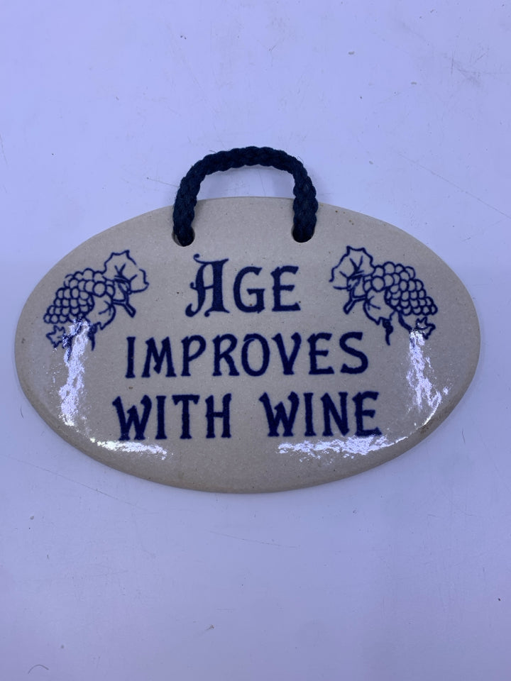 "AGE IMPROVES WITH WINE" OVAL POTTERY SIGN.