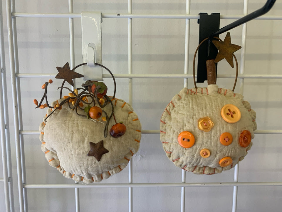 2 PRIMITIVE WALL HANGING PUMPKINS.