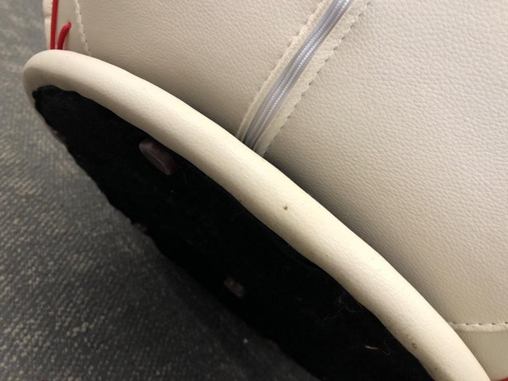 FAUX LEATHER BASEBALL SWIVEL CHAIR & OTTOMAN.