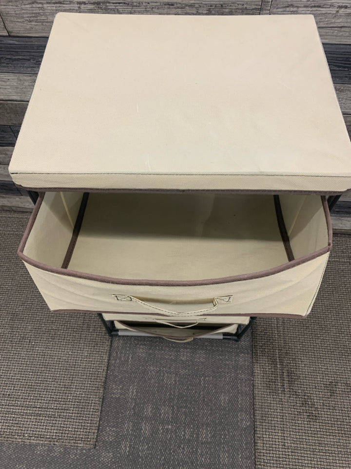 4 CUBE TAN FABRIC STORAGE W/BLACK PLASTIC FRAME.