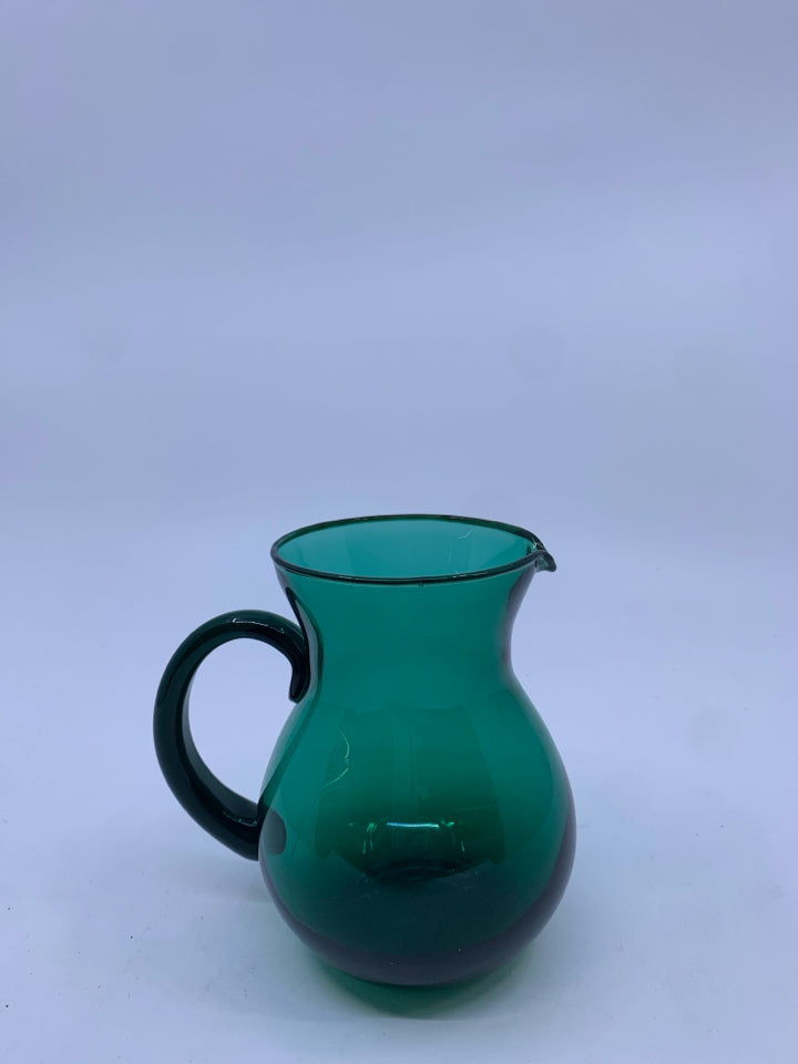 SMALL LIGHT GREEN GLASS PITCHER.