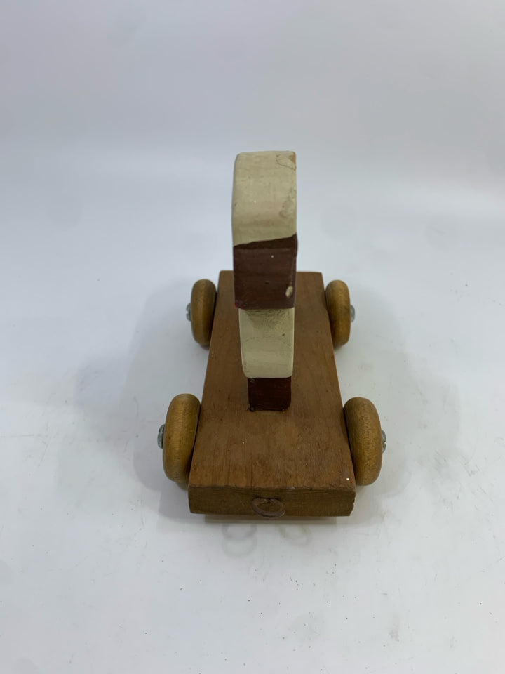 PRIMITIVE WOOD SHEEP ON WHEELS SHELF DECOR.