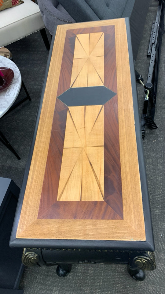 BLACK CONSOLE TABLE W/ TWO TONED STAINED INLAY.