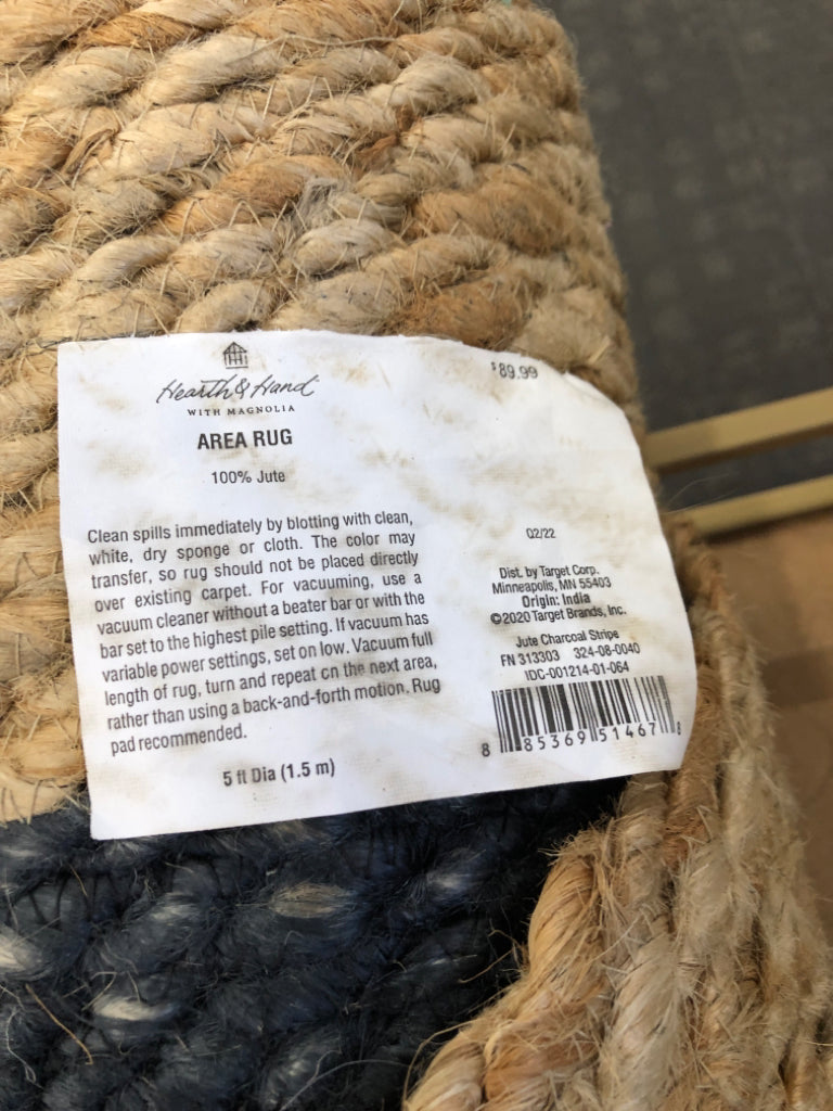 BLACK STRIPED WOVEN JUTE AREA RUG.
