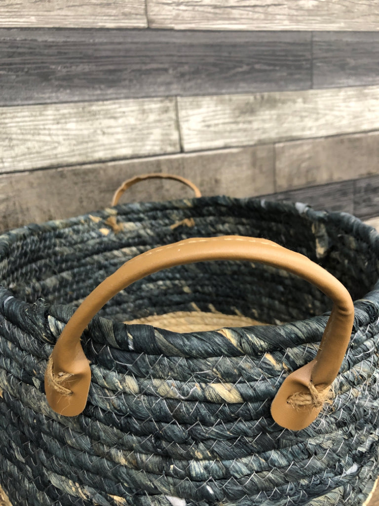 GRAY/BEIGE WOVEN BASKET W/FAUX LEATHER HANDLES.